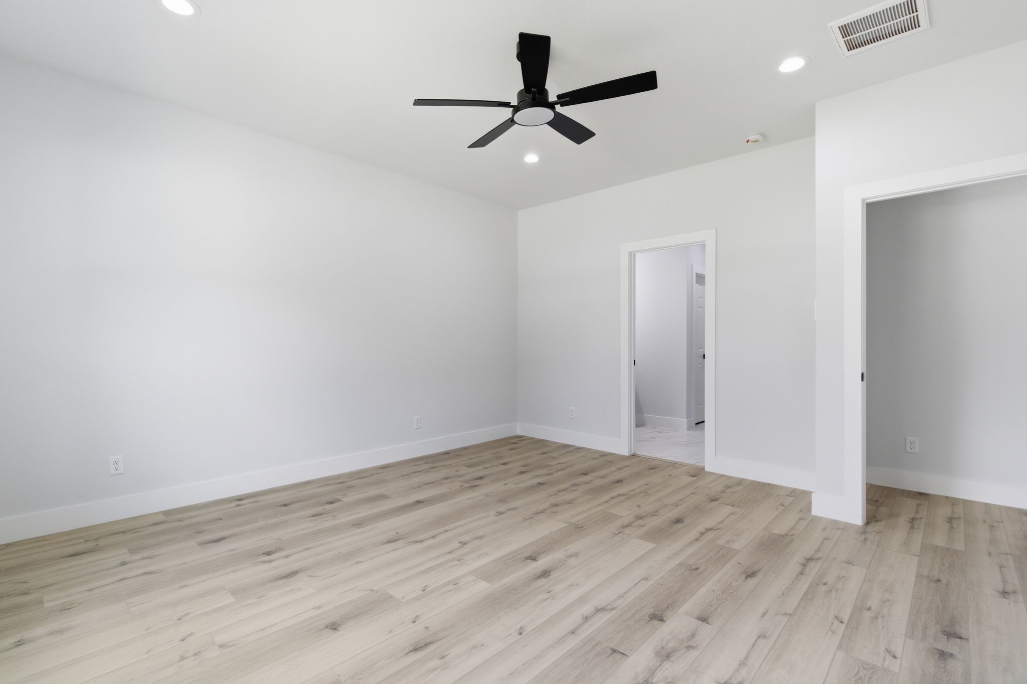 7040 Kinney Street Houston, TX 77087 - Photo 20 of 47 a view of empty room with wooden floor