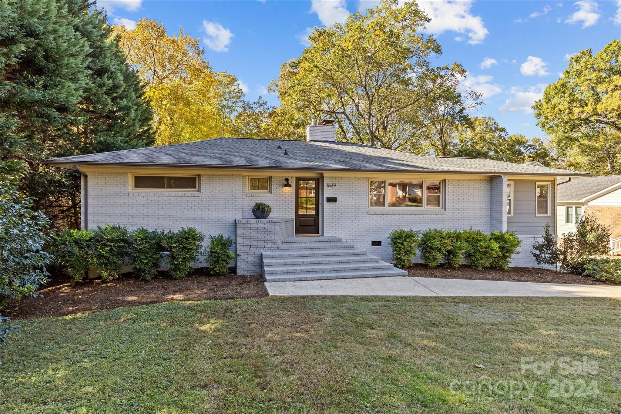 front view of a house with a yard