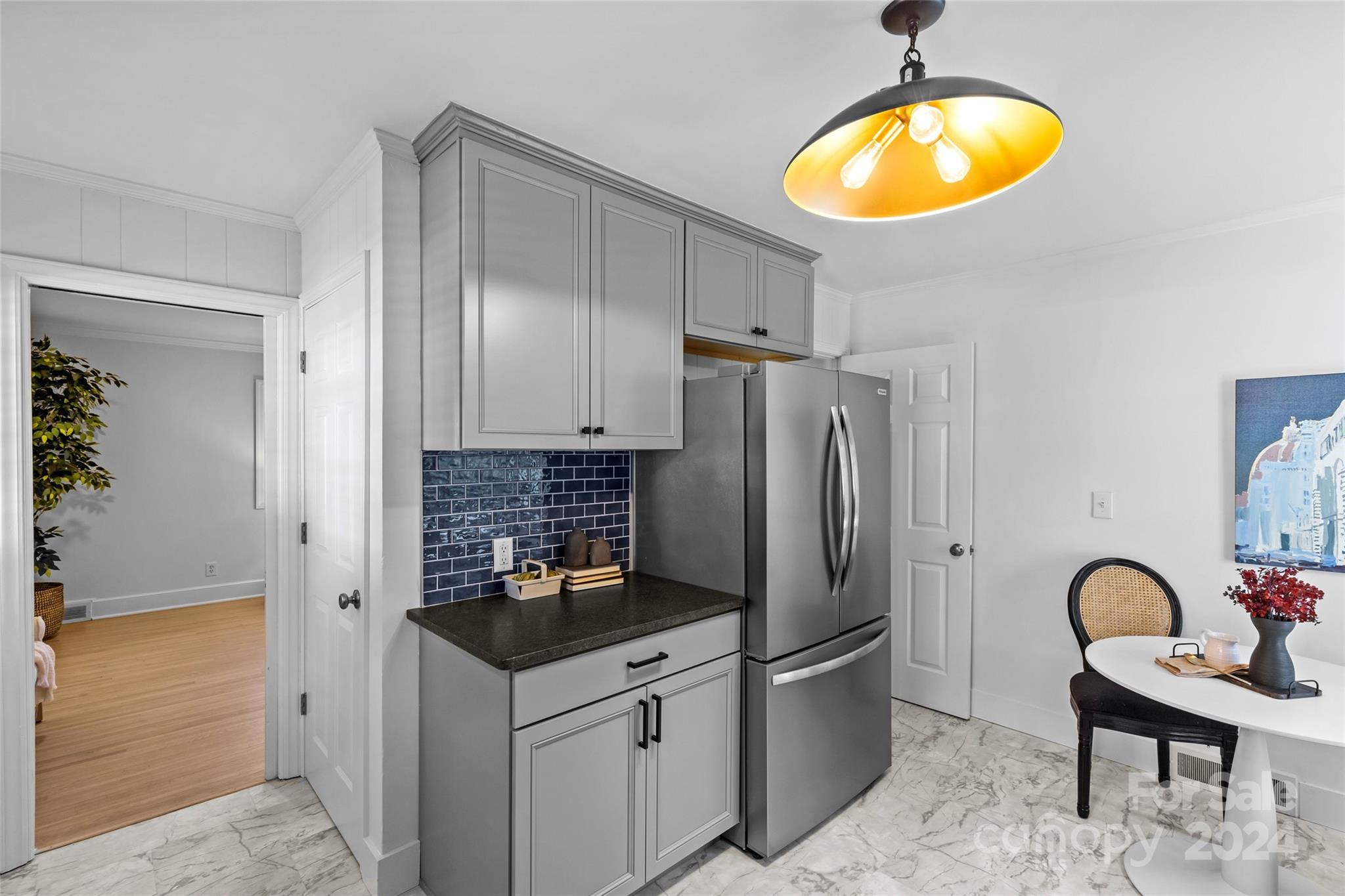 1639 Merry Oaks Road Charlotte, NC 28205 - Photo 17 of 47 a kitchen with stainless steel appliances granite countertop a stove a refrigerator and a microwave