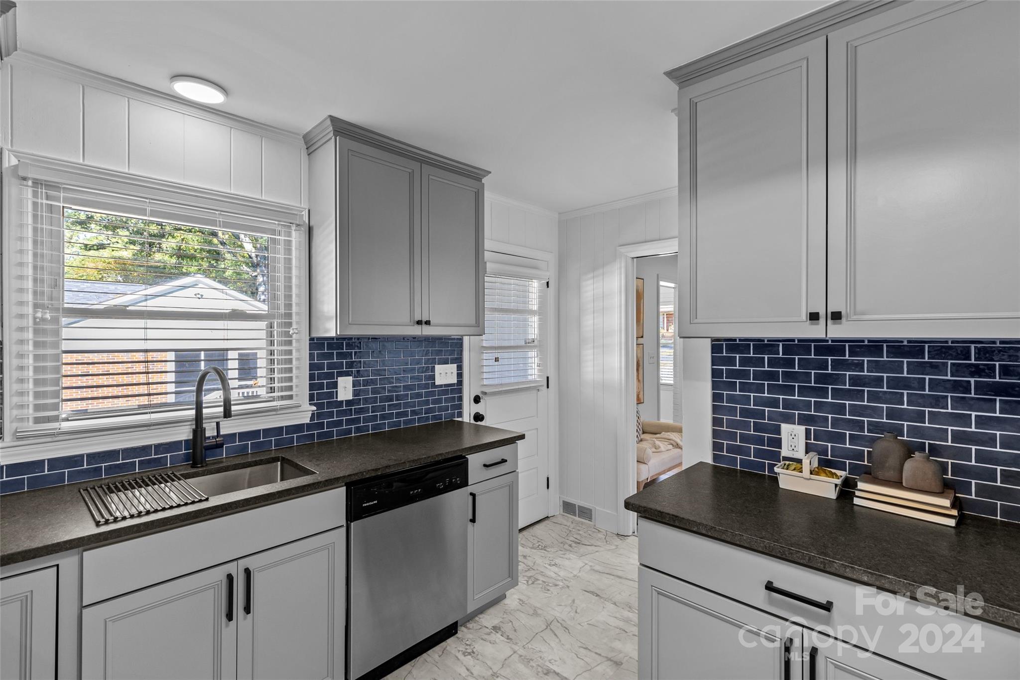 1639 Merry Oaks Road Charlotte, NC 28205 - Photo 19 of 47 a kitchen with a sink and cabinets