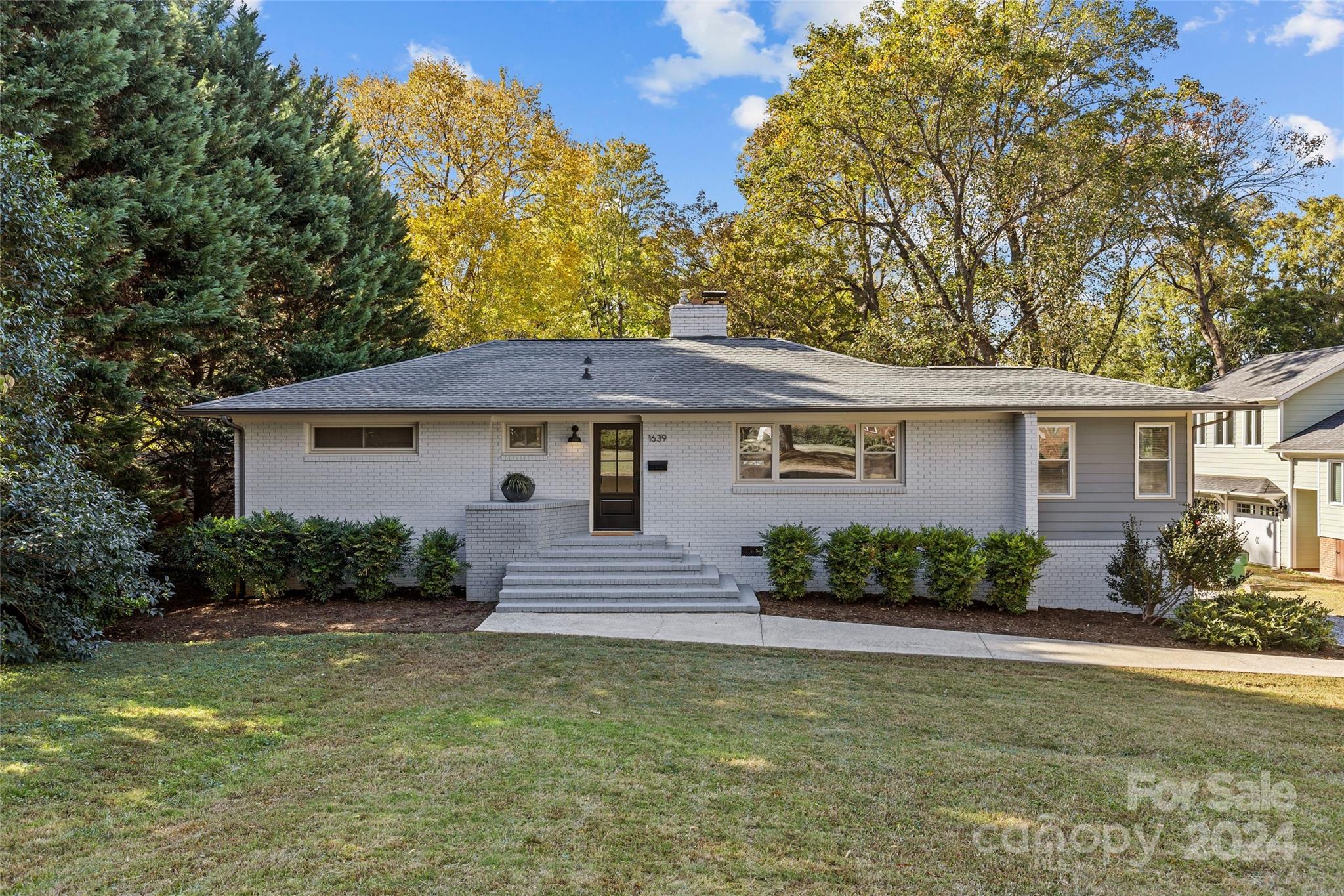 1639 Merry Oaks Road Charlotte, NC 28205 - Photo 2 of 47 a front view of a house with garden