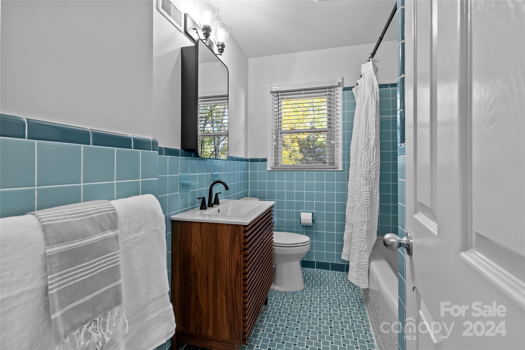 1639 Merry Oaks Road Charlotte, NC 28205 - Photo 24 of 47 a bathroom with a sink toilet and shower