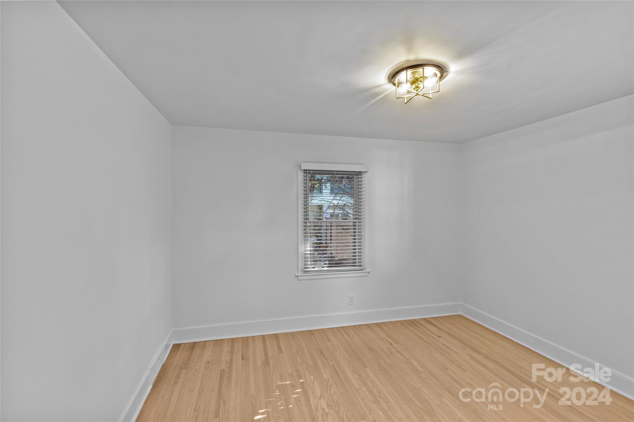 1639 Merry Oaks Road Charlotte, NC 28205 - Photo 26 of 47 an empty room with a window