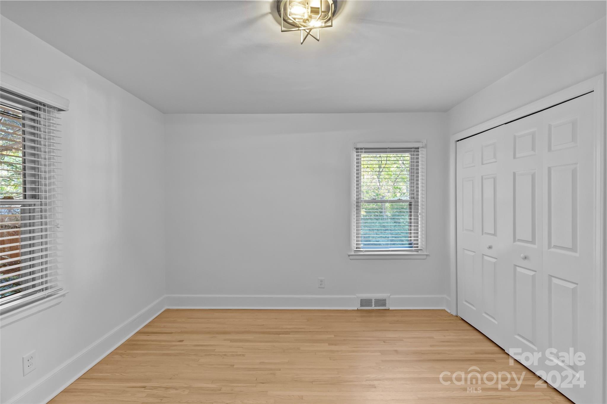 1639 Merry Oaks Road Charlotte, NC 28205 - Photo 27 of 47 wooden floor in an empty room with a window