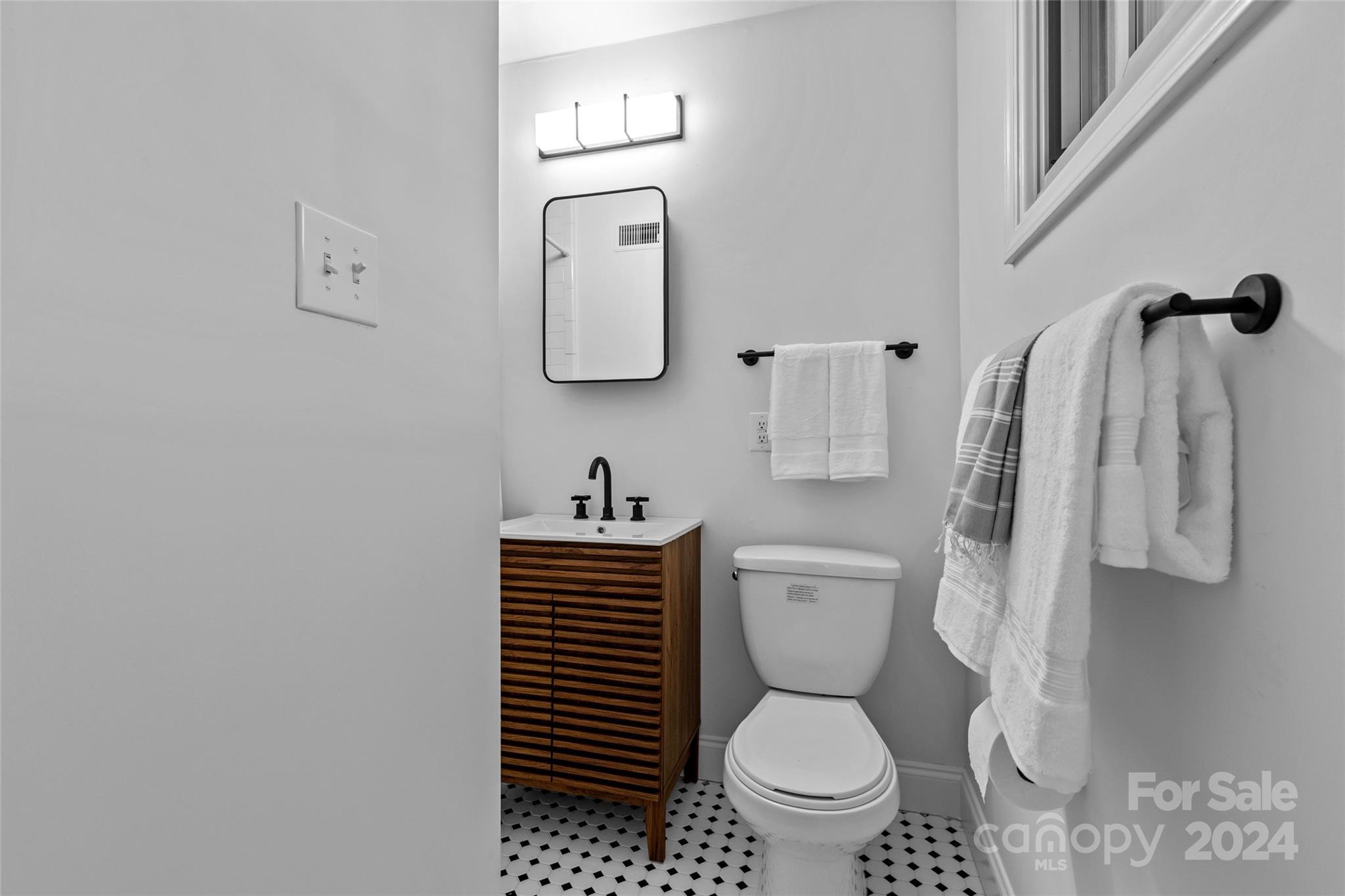 1639 Merry Oaks Road Charlotte, NC 28205 - Photo 32 of 47 a bathroom with a toilet a sink and a shower