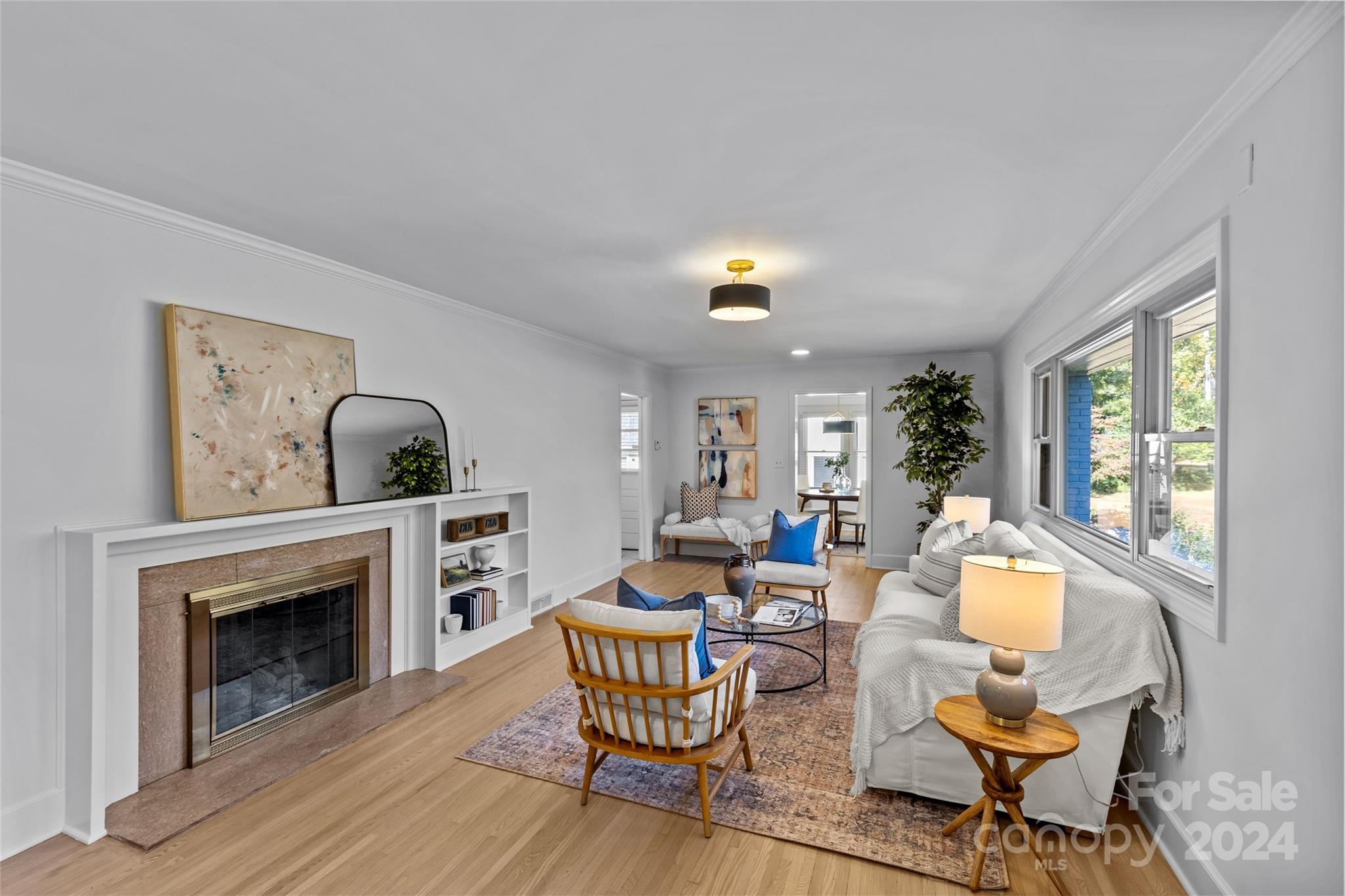 1639 Merry Oaks Road Charlotte, NC 28205 - Photo 7 of 47 a living room with furniture a fireplace and a large window