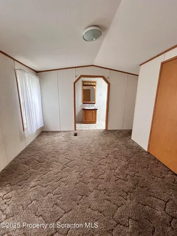 a bathroom with a sink a mirror and a shower