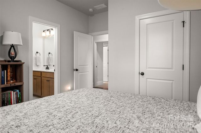 a bedroom with a bed and a television in it