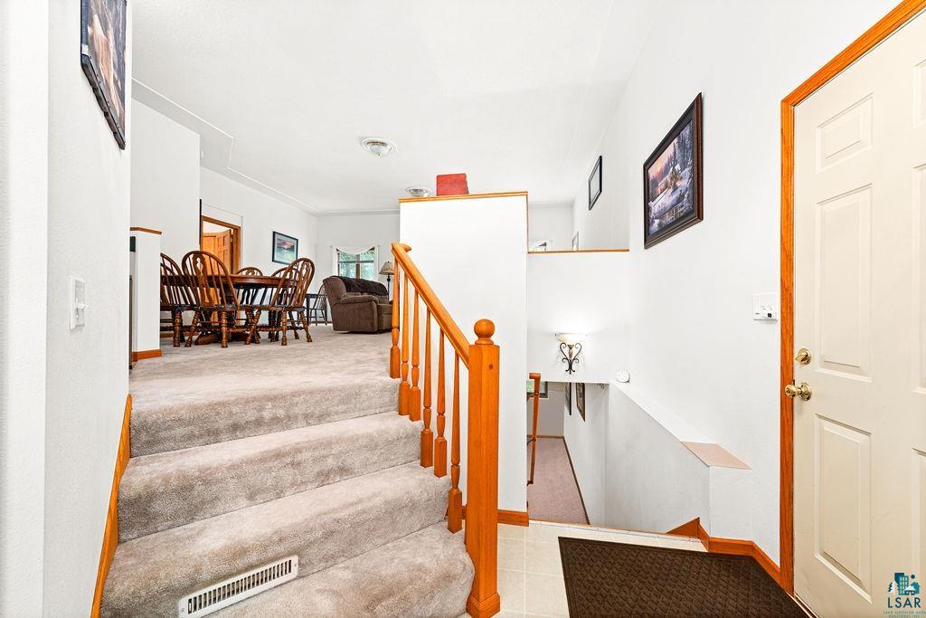 4331 Grouse Ridge Drive Hermantown, MN 55811 - Photo 3 of 48 Staircase with carpet floors