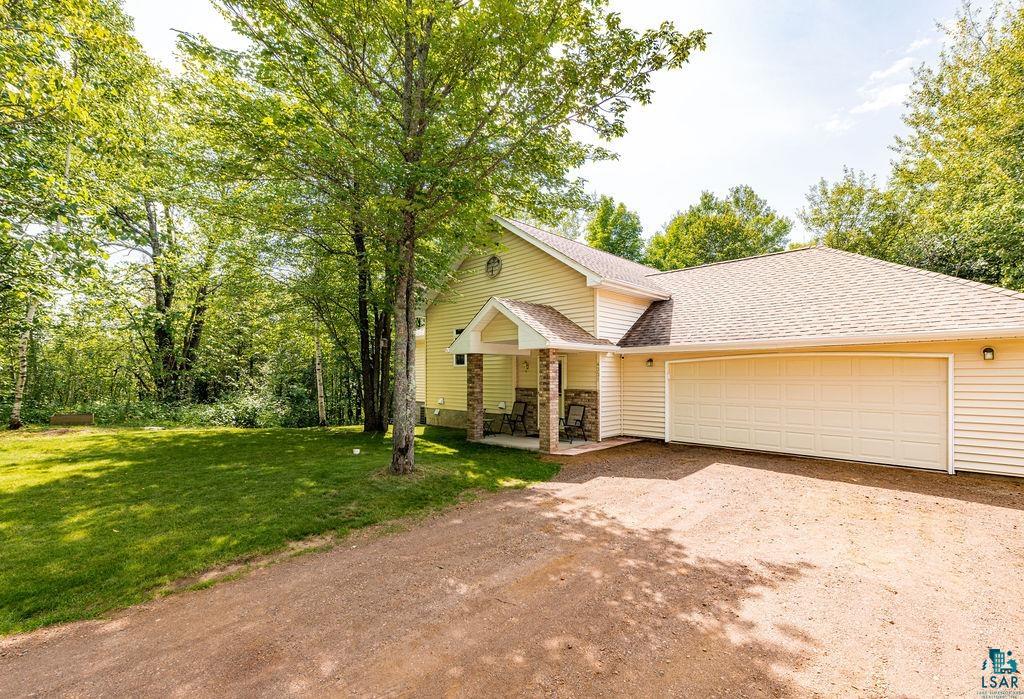 4331 Grouse Ridge Drive Hermantown, MN 55811 - Photo 45 of 48 View of front of house with a front yard and a garage