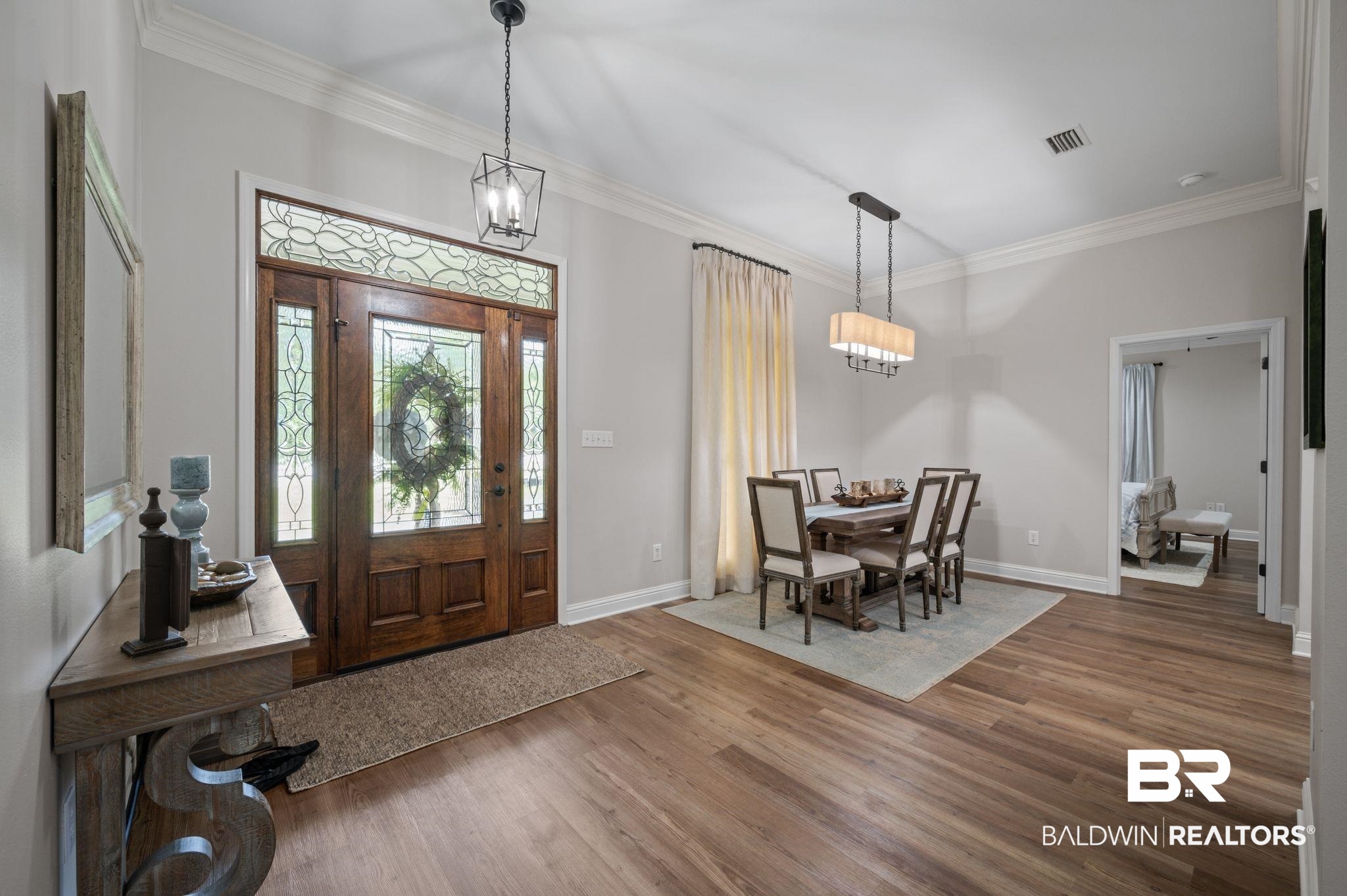 14591 Styx River Road Stapleton, AL 36578 - Photo 7 of 47 Entrance foyer featuring wood finished floors, ornamental molding, baseboards, and a chandelier