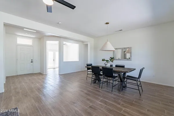 a view of a dining room with furniture window and wooden floor
