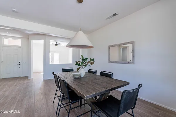 a dining room with furniture and window