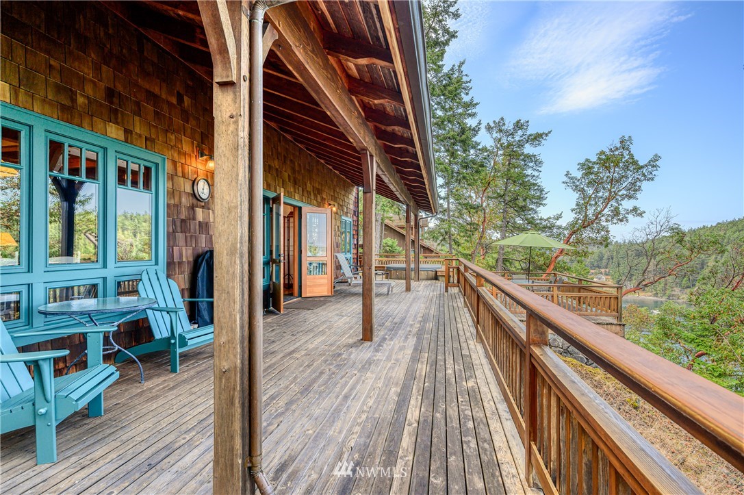 197 East Cove Road Decatur Island, WA 98221 - Photo 14 of 40 a view of balcony with chairs and wooden fence