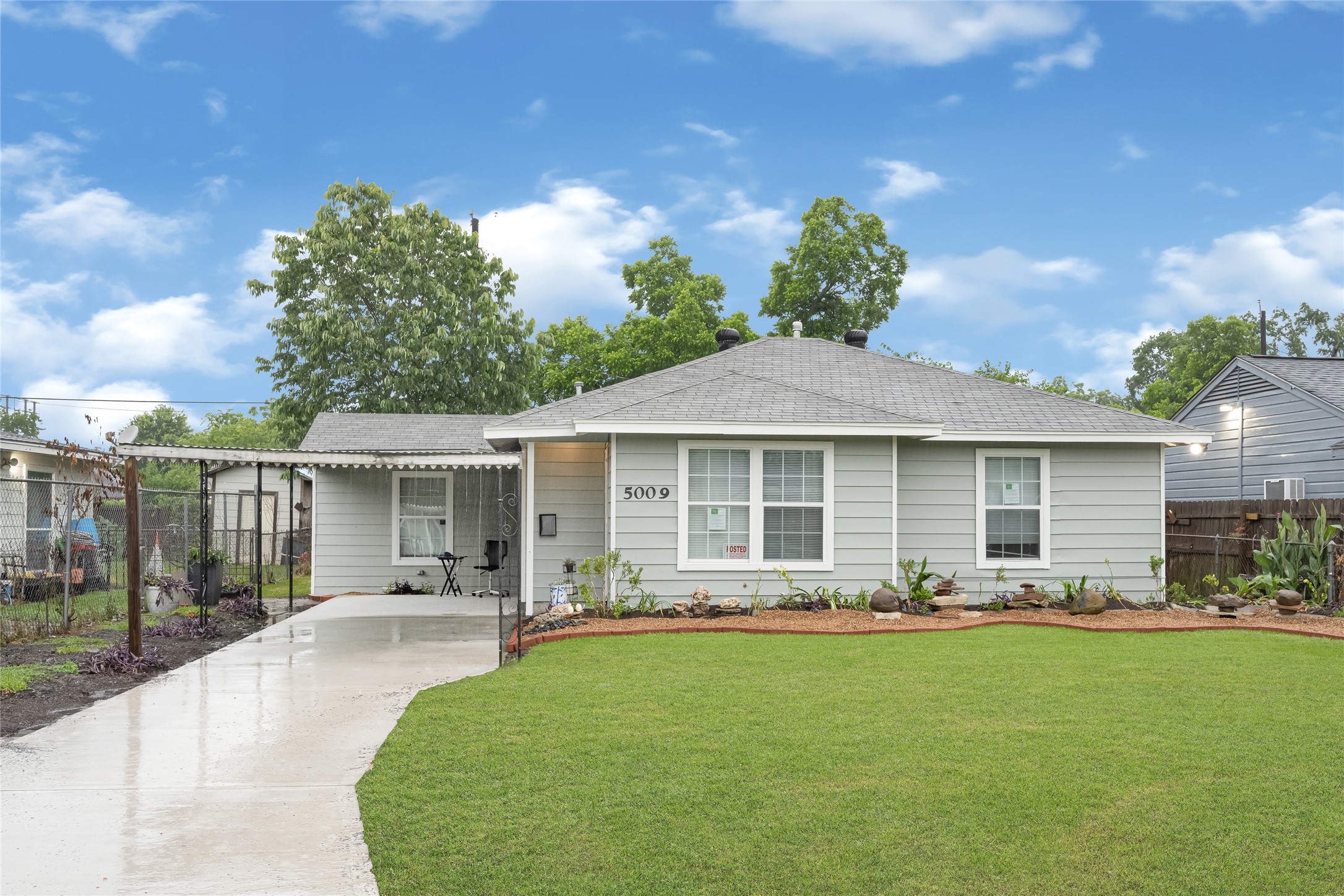 5009 Bataan Road Houston, TX 77033 - Photo 2 of 24 a front view of a house with garden