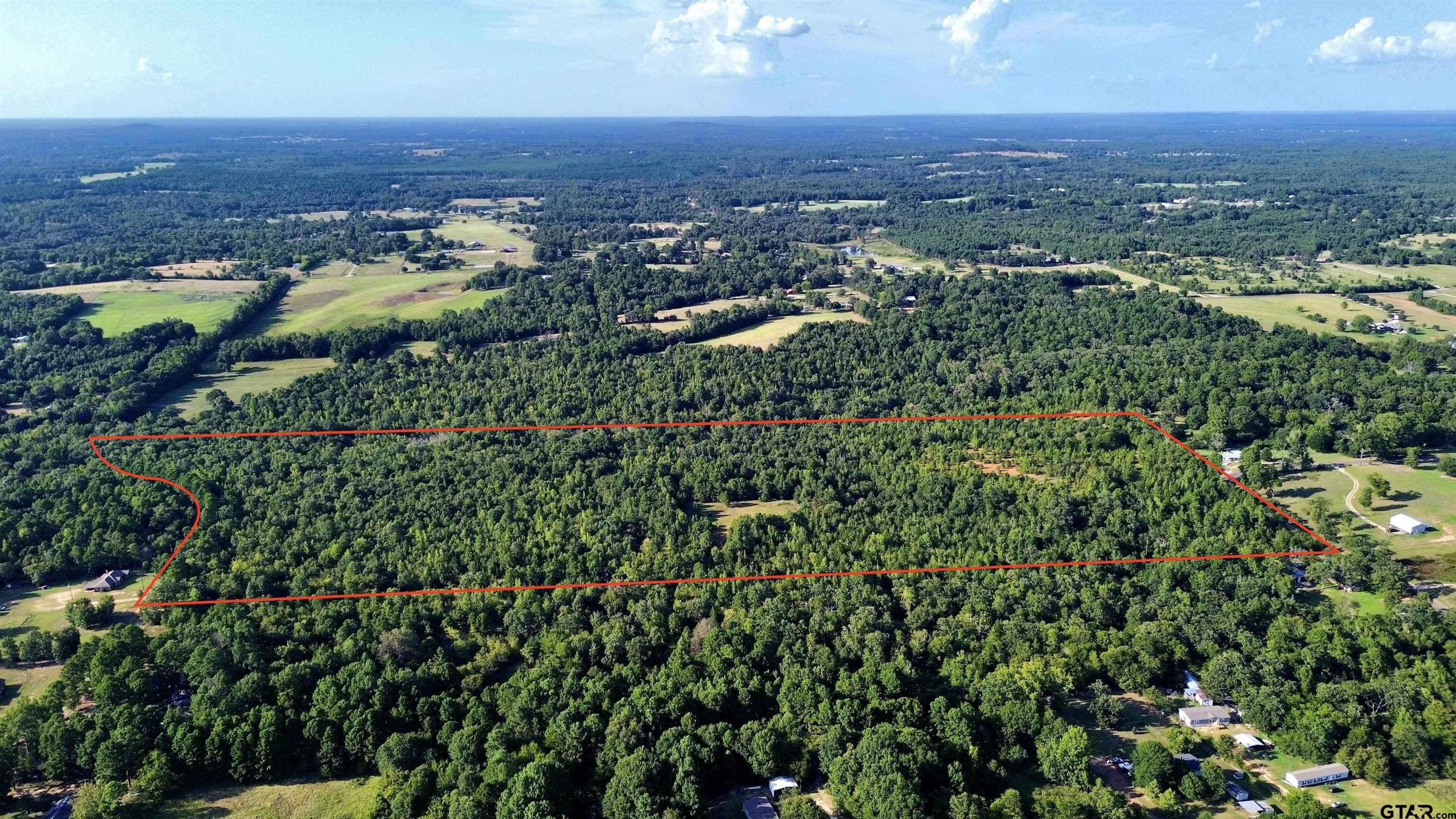 Tbd Silver Spruce Road Gilmer, TX 75645 - Photo 2 of 12 an aerial view of residential house with outdoor space and trees all around
