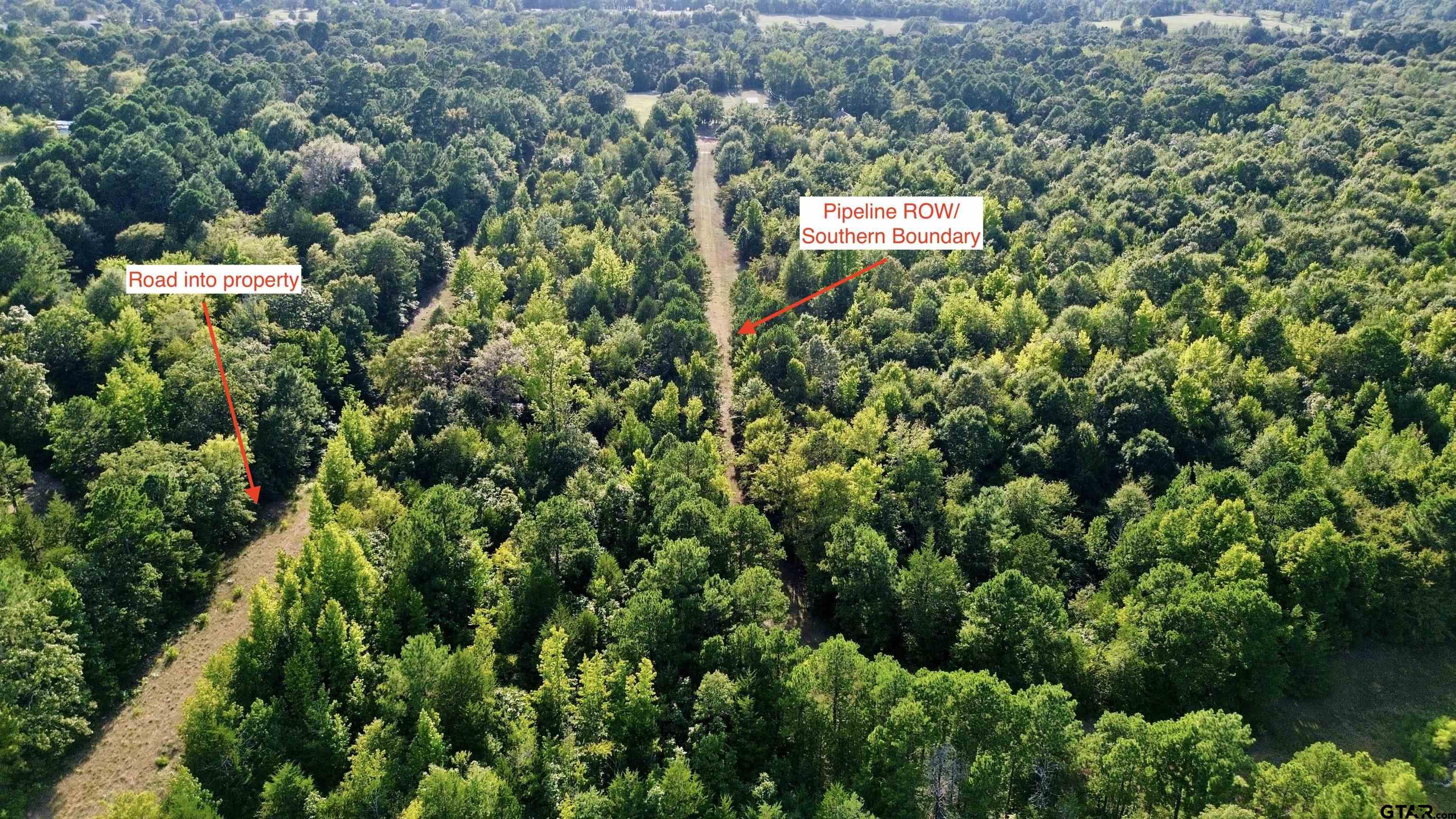 Tbd Silver Spruce Road Gilmer, TX 75645 - Photo 8 of 12 an aerial view of a house with a yard and green space