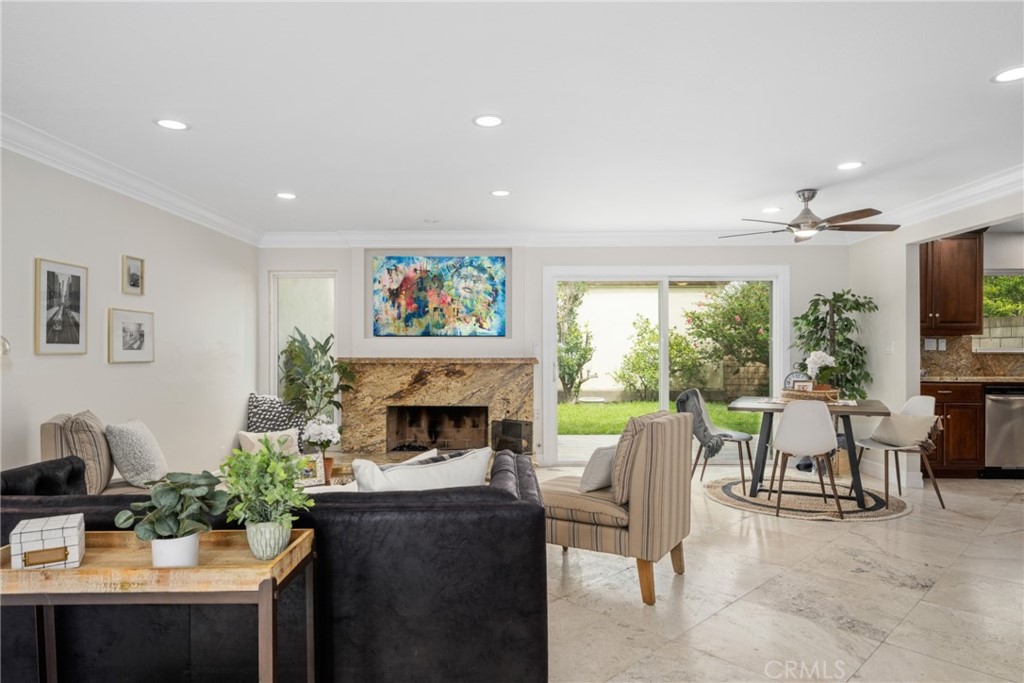 4091 Germainder Way Irvine, CA 92612 - Photo 4 of 47 a living room with furniture and a fireplace