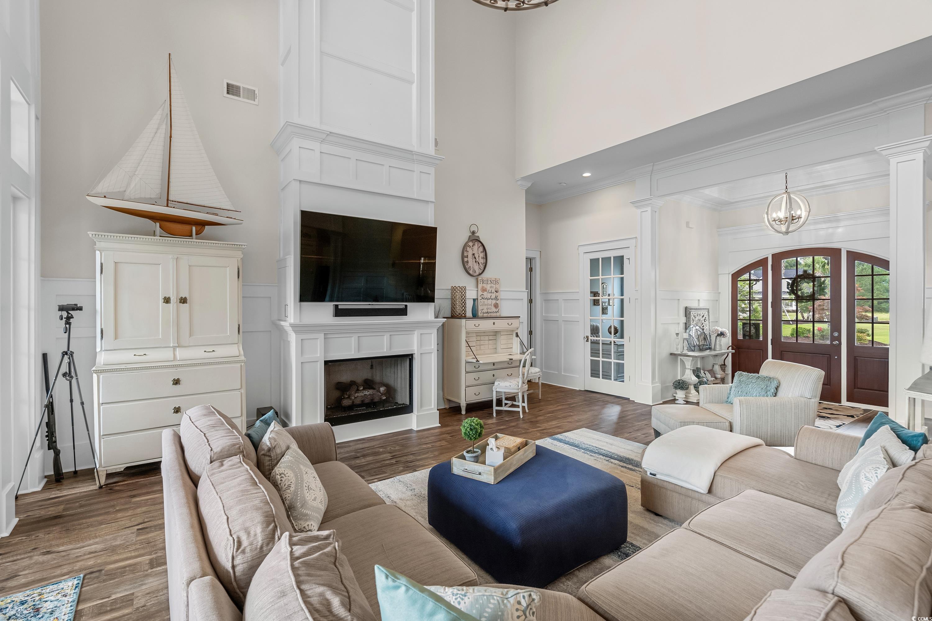 348 Chamberlin Road Myrtle Beach, SC 29588 - Photo 12 of 40 Living room with a high ceiling, a chandelier, dec
