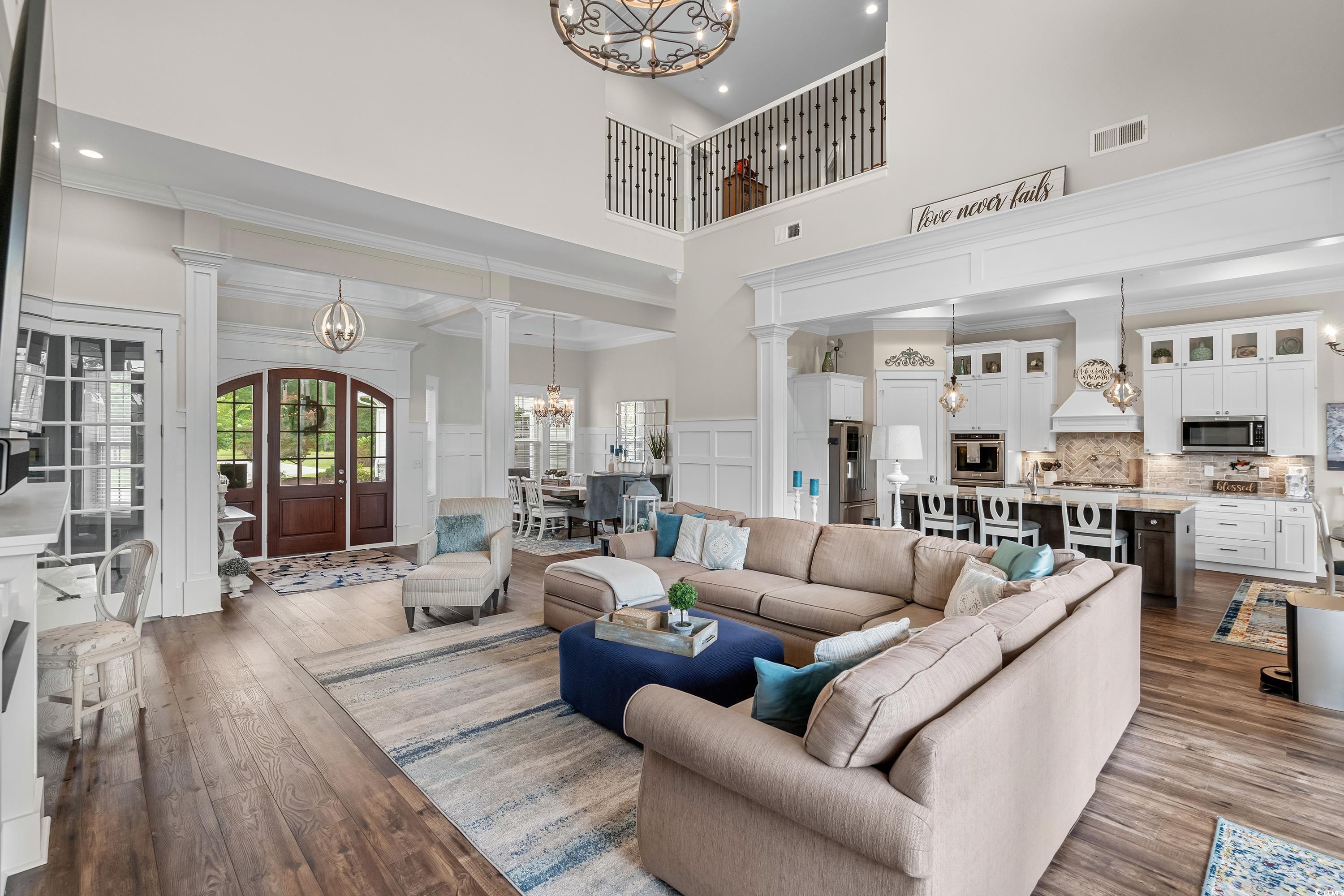 348 Chamberlin Road Myrtle Beach, SC 29588 - Photo 14 of 40 Living room featuring decorative columns, crown mo
