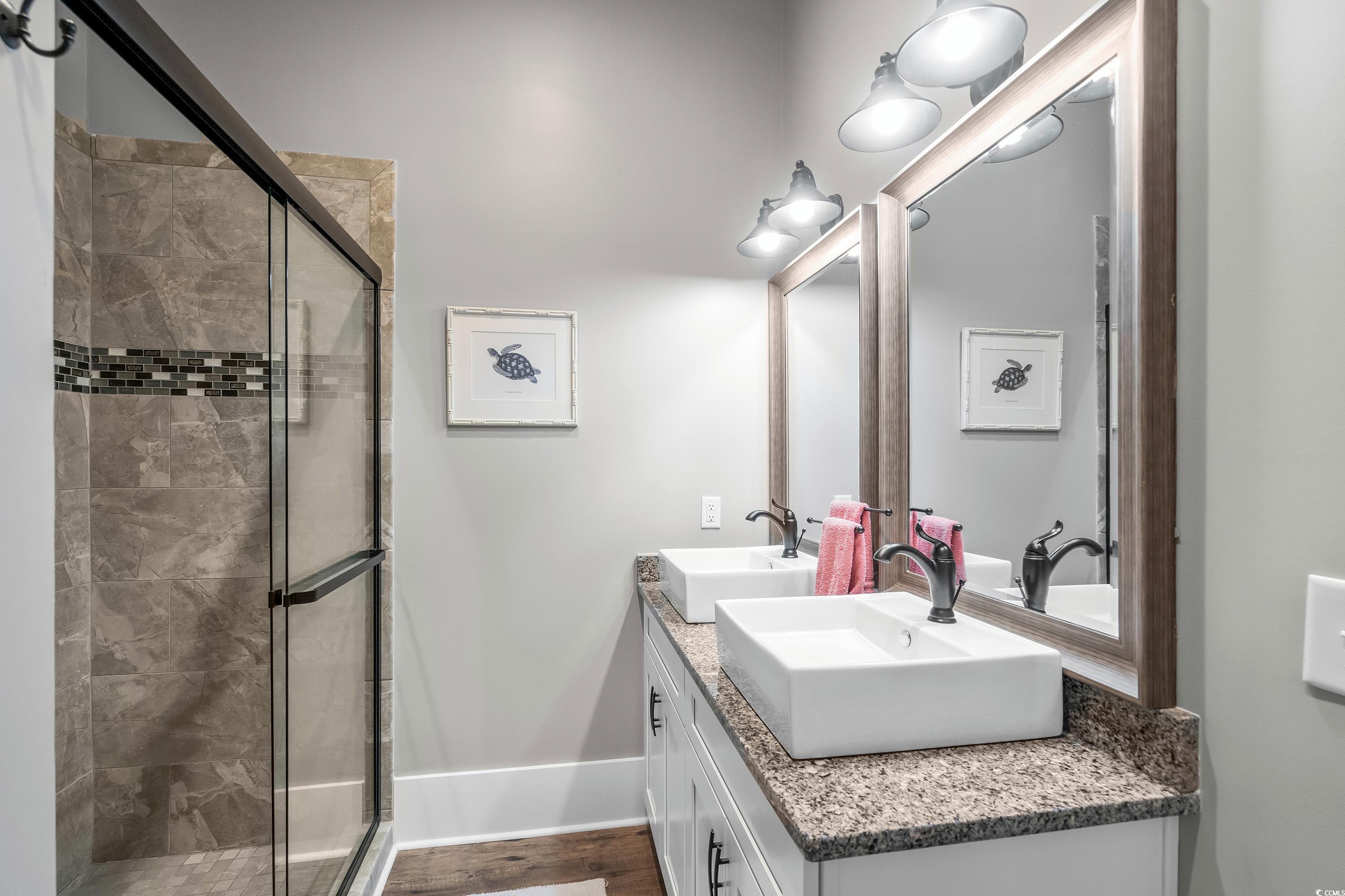 348 Chamberlin Road Myrtle Beach, SC 29588 - Photo 35 of 40 Bathroom featuring dual vanity and an enclosed sho