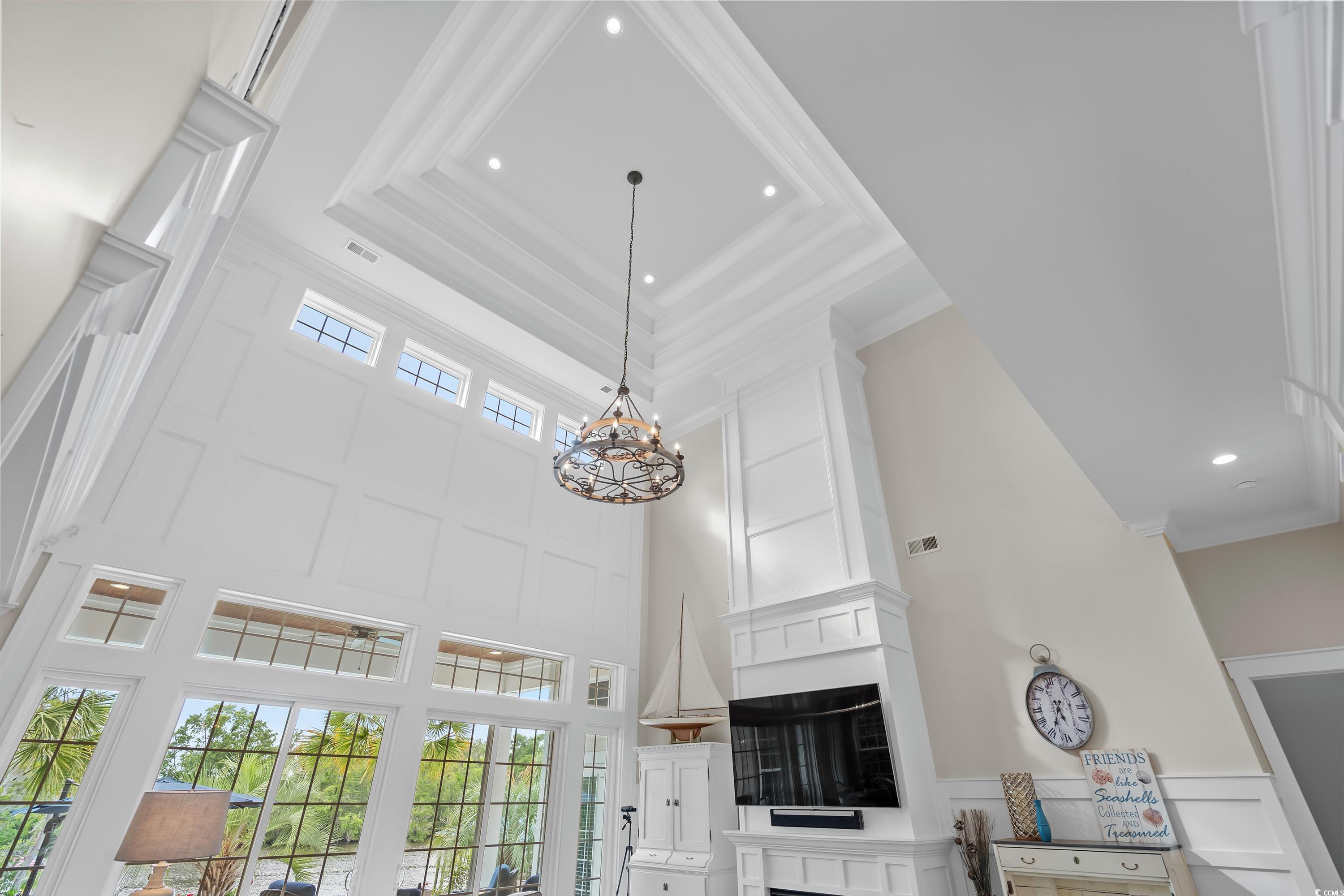 348 Chamberlin Road Myrtle Beach, SC 29588 - Photo 9 of 40 Details with a chandelier, crown molding, and a tr
