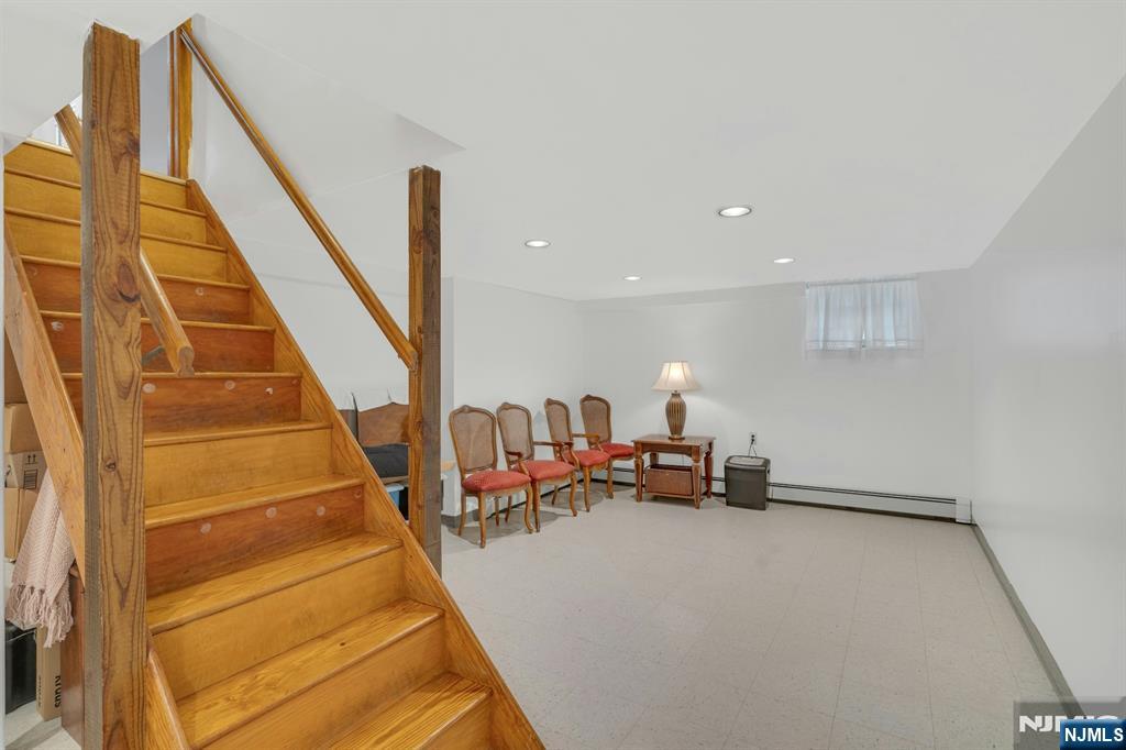 24 Cambridge Road Tenafly, NJ 07670 - Photo 24 of 31 a living room with furniture and a potted plant