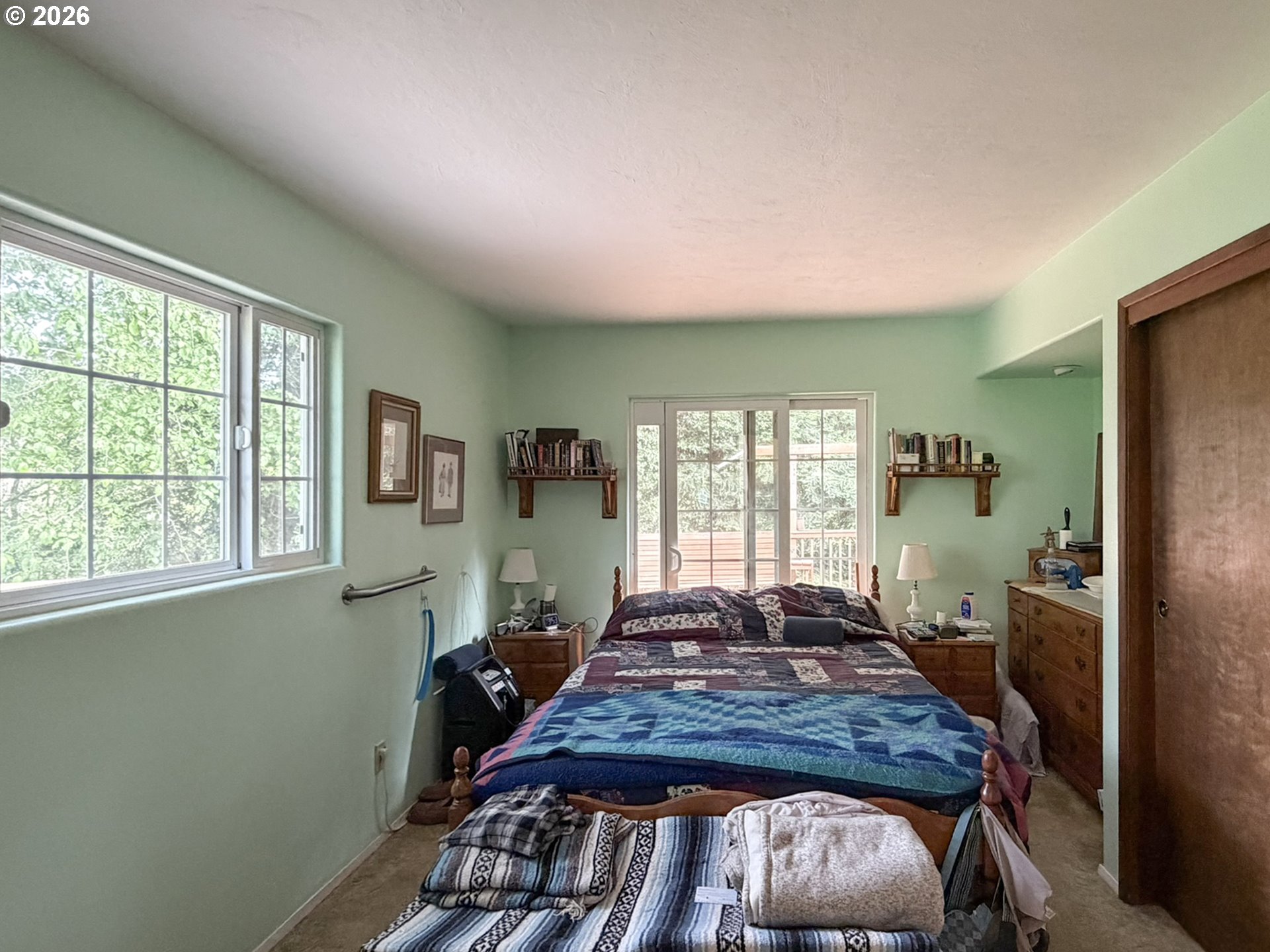 1372 Hampton Road Brookings, OR 97415 - Photo 29 of 42 a bedroom with a bed and wooden floor