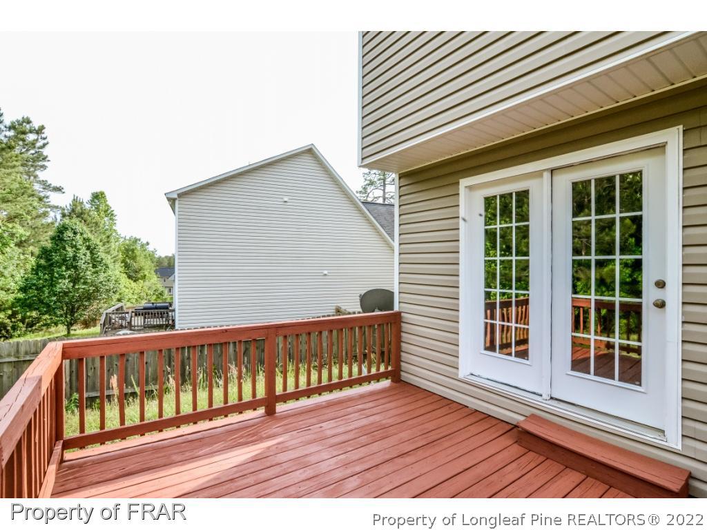 67 Pender Road Spring Lake, NC 28390 - Photo 31 of 34 a view of wooden balcony with a bench