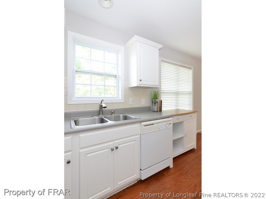 67 Pender Road Spring Lake, NC 28390 - Photo 10 of 34 a kitchen with a sink cabinets and window