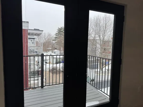 a view of a large window with wooden floor