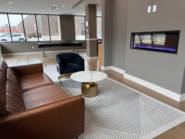 an open kitchen with a table and chairs