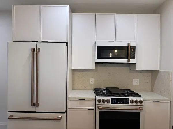 a kitchen with a stove and a microwave