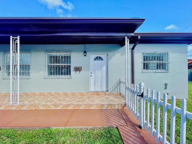 a view of a backyard of a house
