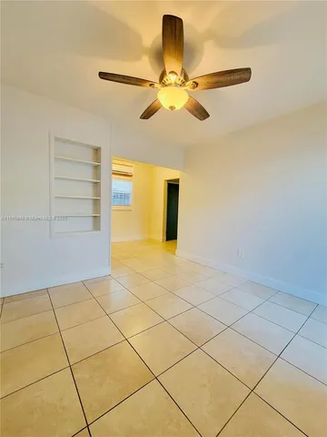 a view of a room with a cabinets and wooden floor