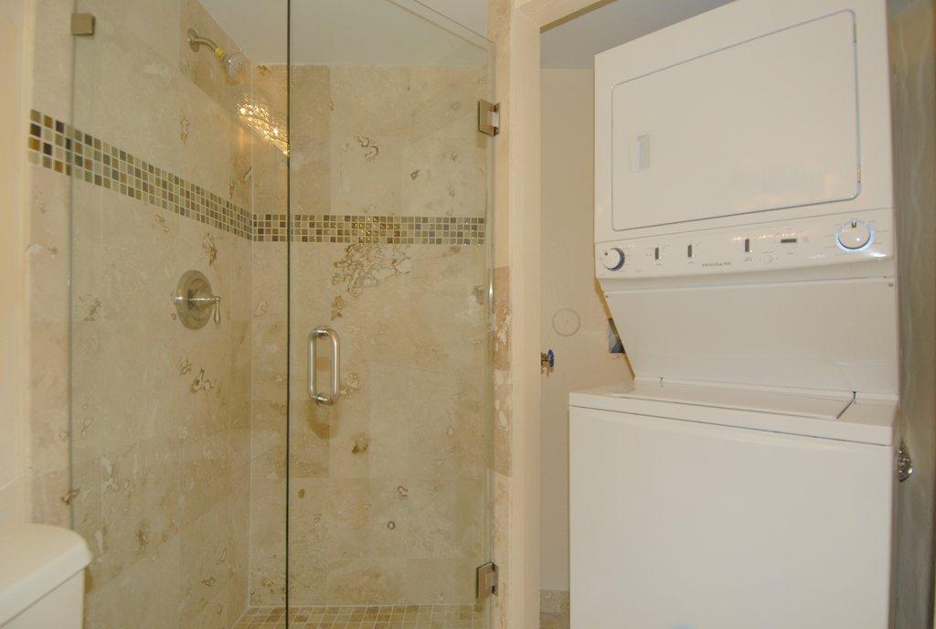 8122 Severn Drive, Unit A Boca Raton, FL 33433 - Photo 11 of 30 a bathroom with a shower and a toilet
