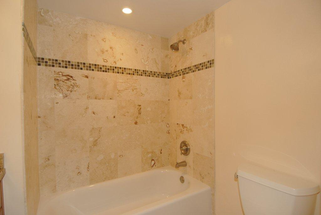 8122 Severn Drive, Unit A Boca Raton, FL 33433 - Photo 20 of 30 a bathroom with a shower and a bath tub