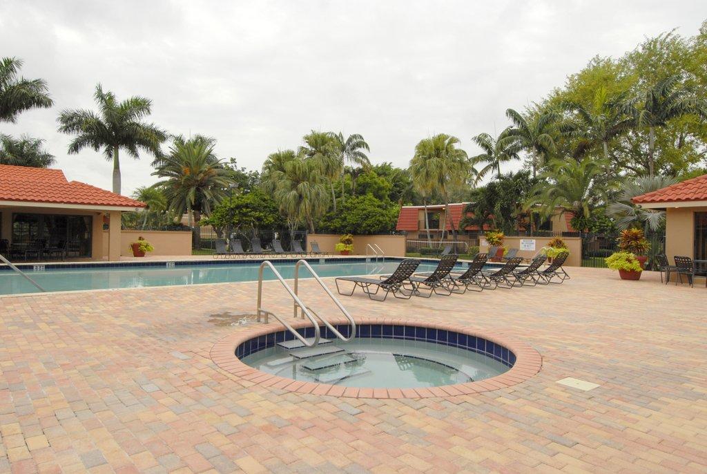 8122 Severn Drive, Unit A Boca Raton, FL 33433 - Photo 28 of 30 a view of a swimming pool with a patio