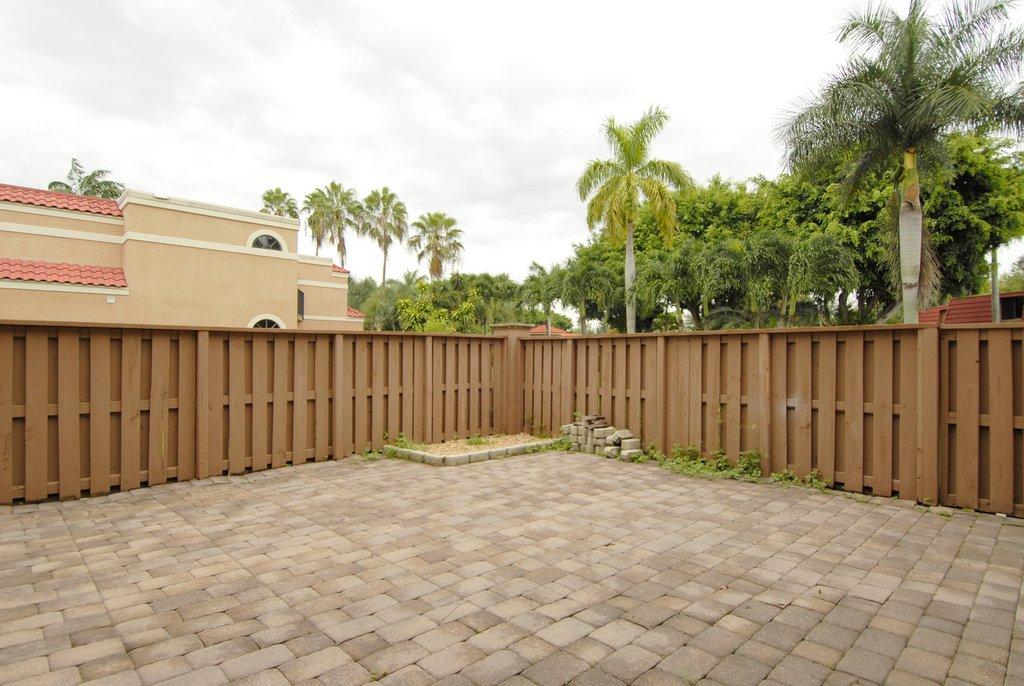 8122 Severn Drive, Unit A Boca Raton, FL 33433 - Photo 4 of 30 a view of small space with wooden fence