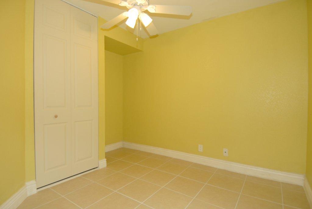 8122 Severn Drive, Unit A Boca Raton, FL 33433 - Photo 9 of 30 a view of an empty room with a fan