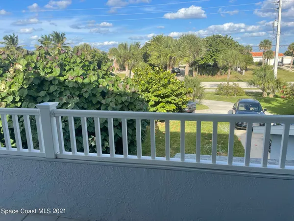 a view of a wooden bench in a balcony