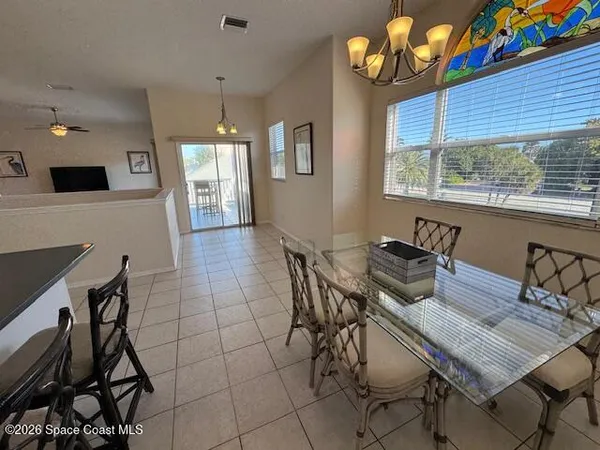a kitchen with stainless steel appliances a refrigerator and cabinets