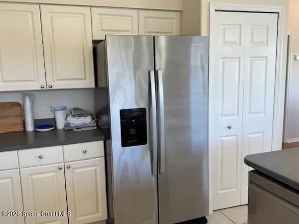 a kitchen with stainless steel appliances a stove a sink a counter top space and cabinets