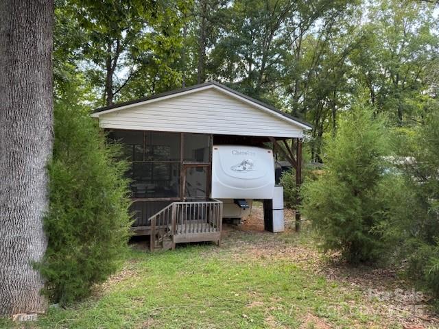 203 River Ridge Trail Mount Gilead, NC 27306 - Photo 2 of 9 a view of a house with a yard balcony and wooden fence