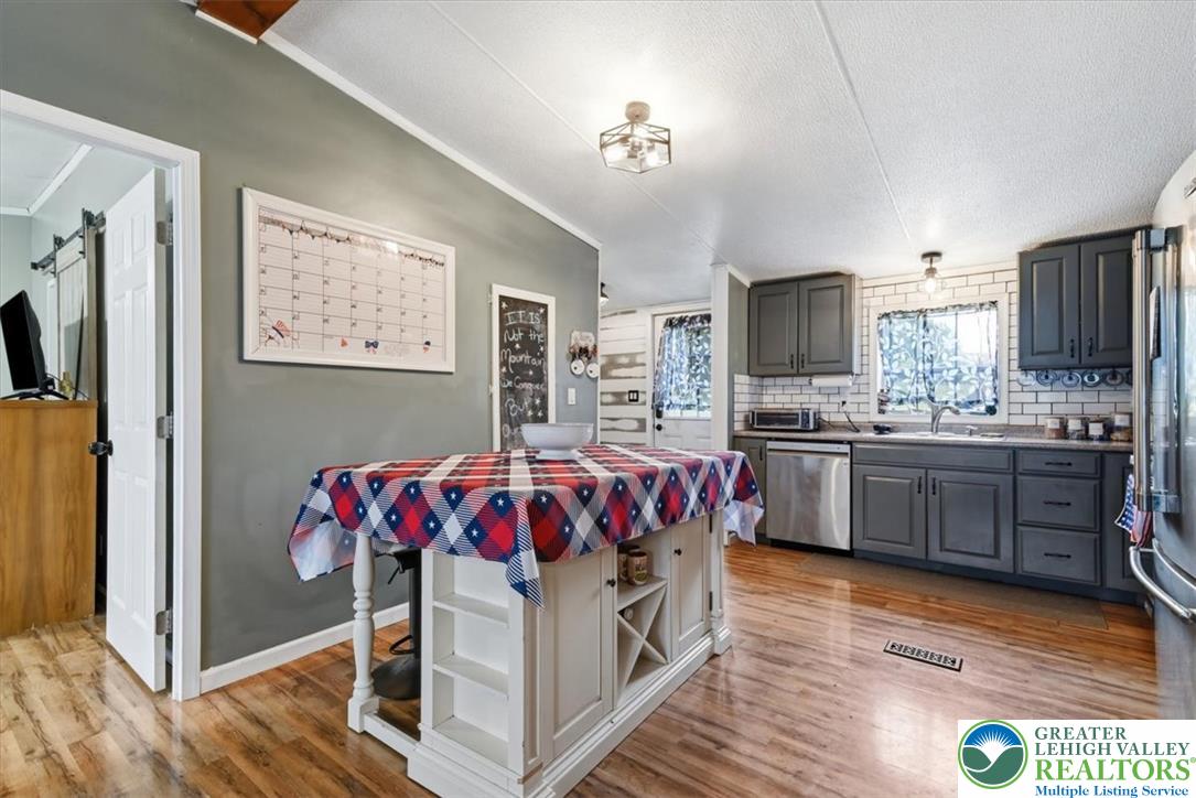 634 Main Road Lehighton, PA 18235 - Photo 11 of 39 A well-appointed kitchen showcasing durable wood flooring and modern cabinetry, perfect for culinary adventures.