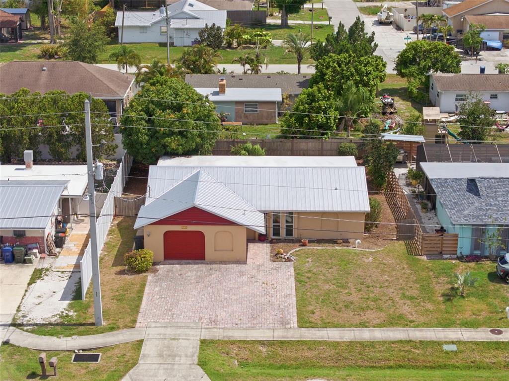 4536 Webber Street Sarasota, FL 34232 - Photo 1 of 45 a aerial view of a house with swimming pool lawn chairs and yard