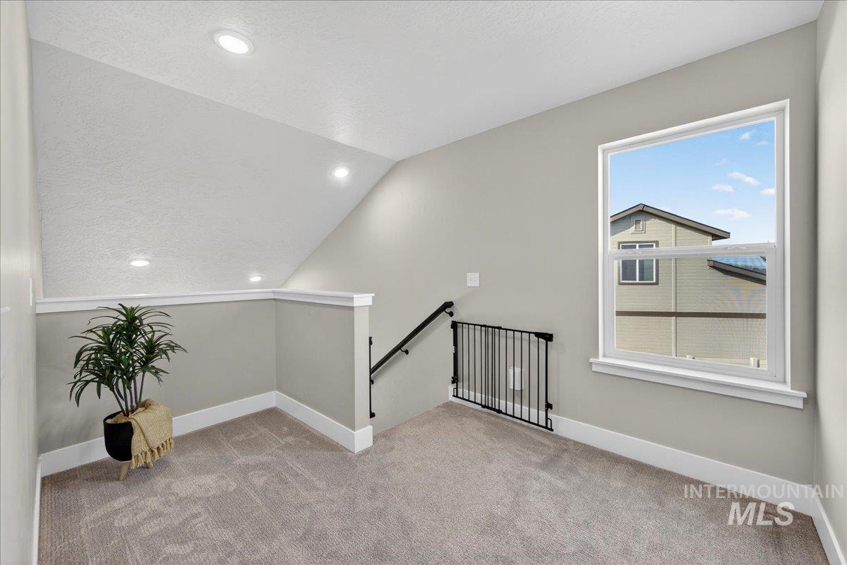 6025 South Catria Place Meridian, ID 83642 - Photo 14 of 34 Bonus room with recessed lighting and light carpet