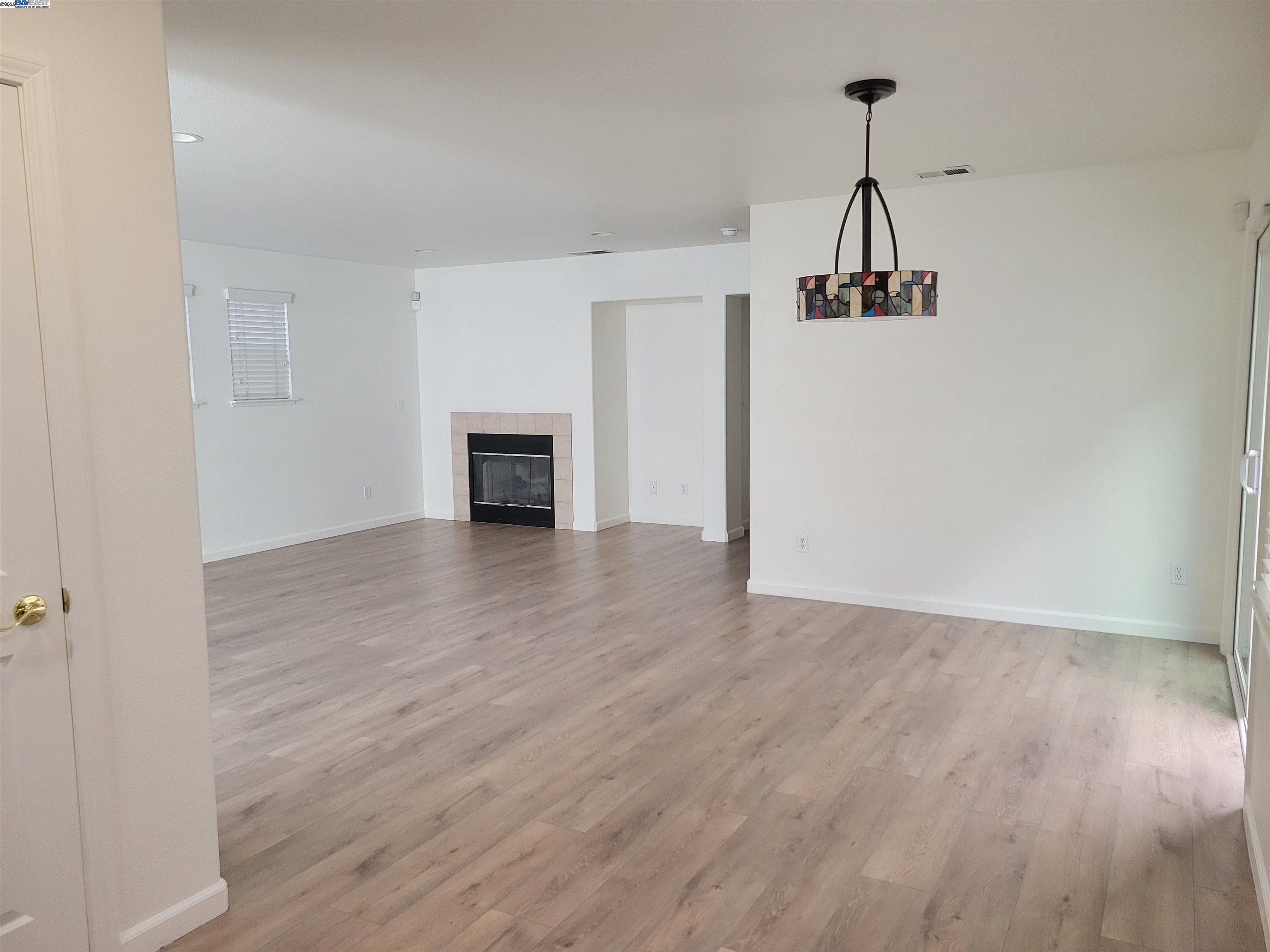 313 Turnstone Circle Pittsburg, CA 94565 - Photo 14 of 16 a view of empty room with wooden floor