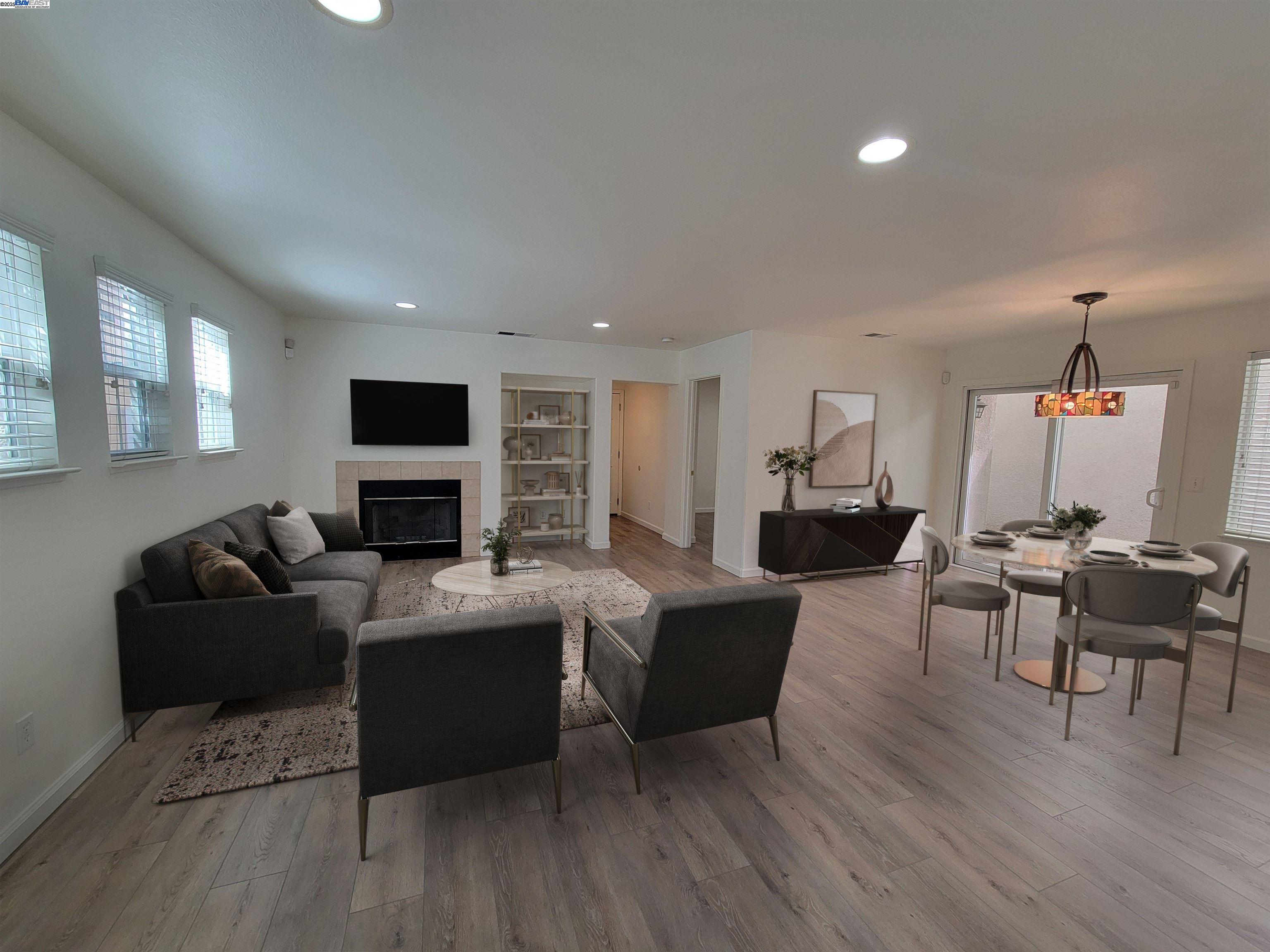 313 Turnstone Circle Pittsburg, CA 94565 - Photo 5 of 16 a living room with furniture a flat screen tv and a fireplace