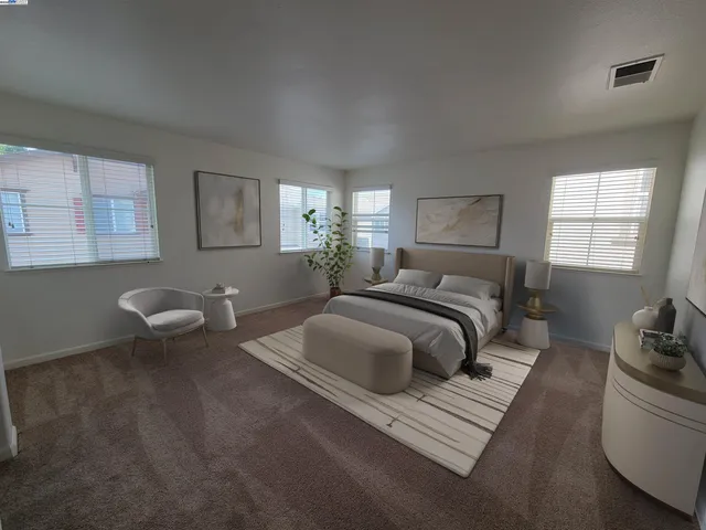 a bedroom with a bed and window